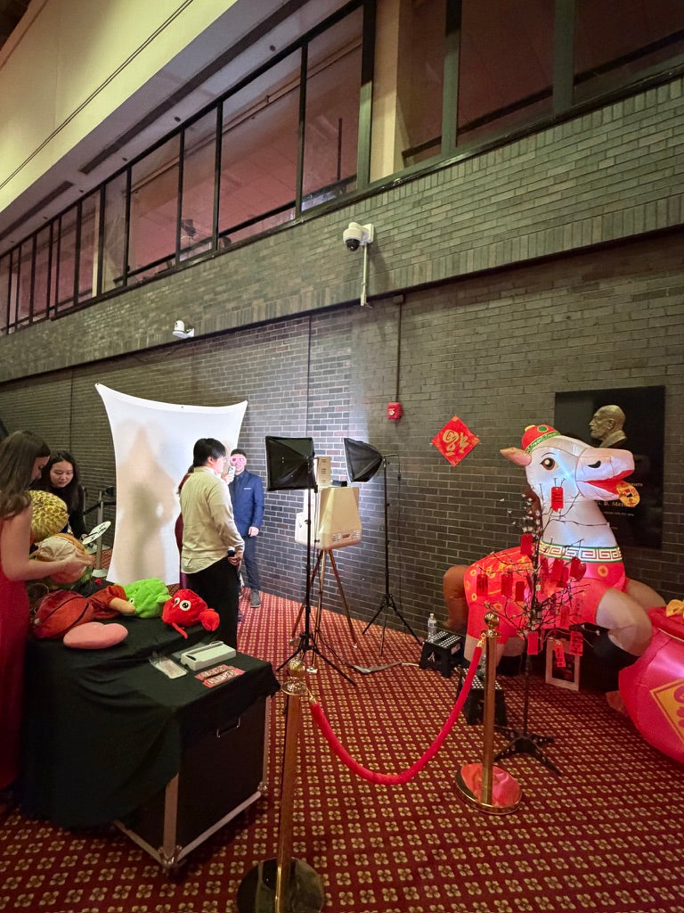 Memory Shop photo booth setup with props and backdrop
